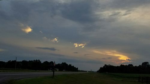 Scenic view of landscape against cloudy sky