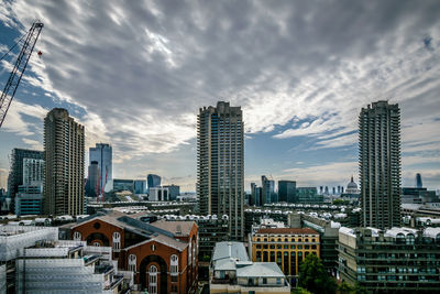 Modern buildings in city against sky