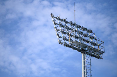 Low angle view of communications tower against sky