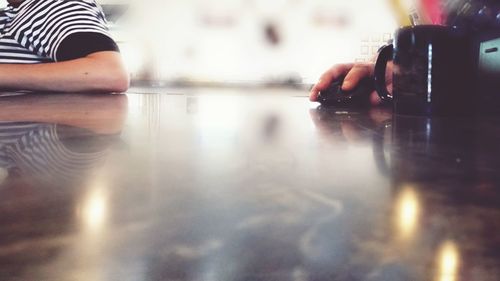 Cropped image of hands on table