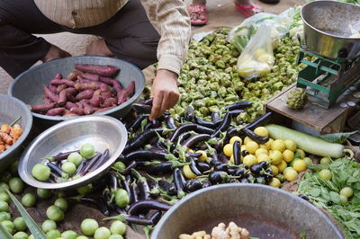 Man buying vegetables at market