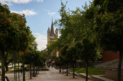 Panoramic view of trees and buildings against sky