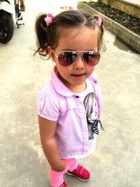 Girl holding ice cream outdoors