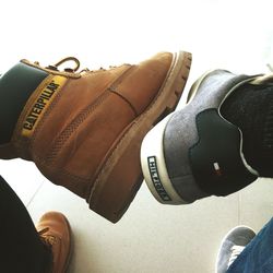 Close-up of shoes on tiled floor