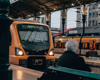 Rear view of man in train