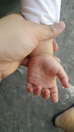 Close-up of human hand holding hands