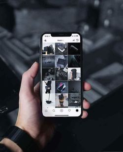 Close-up of hand using smart phone
