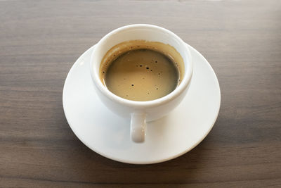 High angle view of coffee cup on table