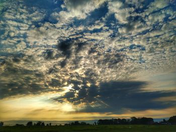 Scenic view of dramatic sky during sunset