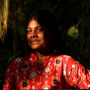 Portrait of young woman standing outdoors