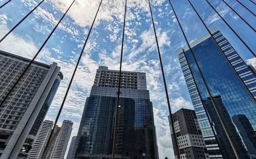 Low angle view of modern buildings against sky