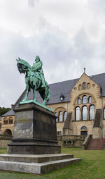 Low angle view of statue against building