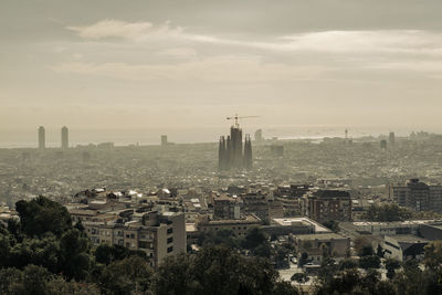 Aerial view of the city of barcelona and the basilica of the sagrada familia by antoni gaudi