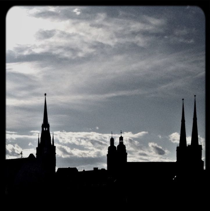 building exterior, architecture, built structure, silhouette, sky, religion, place of worship, church, cloud - sky, low angle view, spirituality, cloud, cloudy, sunset, dusk, cathedral, high section, steeple
