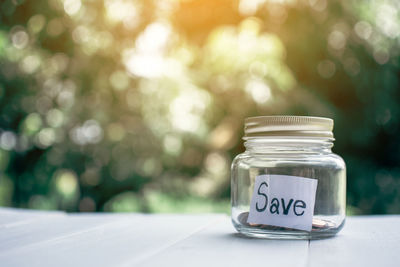 Jar with save label on table