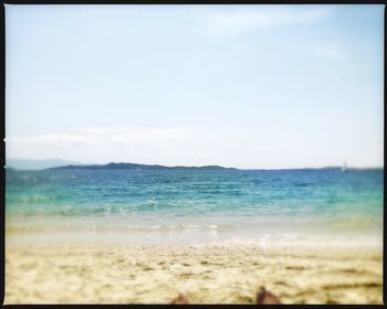 Scenic view of beach against clear sky