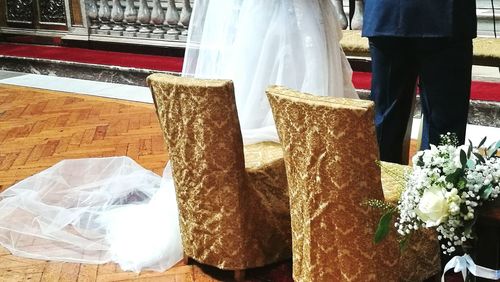 Close-up of couple holding bouquet