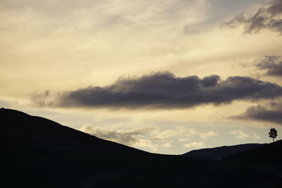 Low angle view of silhouette mountain against sky