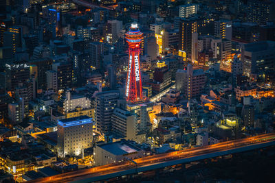 High angle view of city lit up at night