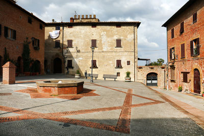 Buildings and walkway against sky