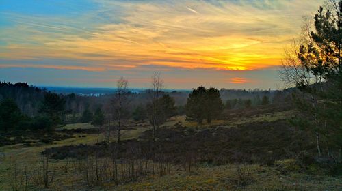 Scenic view of landscape against cloudy sky