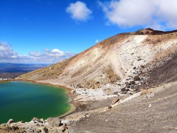 Scenic view of volcanic lake against sky in a natural park