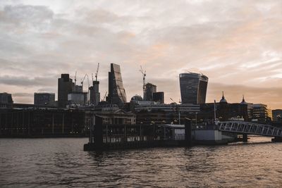 Scenic view of river against sky during sunset