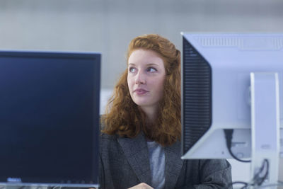 Employee in an office thinking