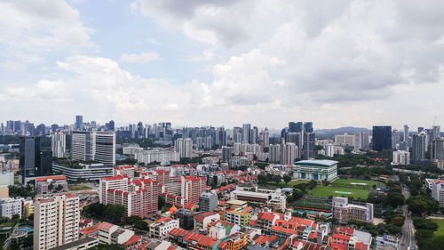 High angle view of buildings in city against sky