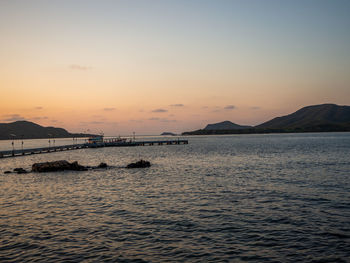 Scenic view of sea against sky at sunset