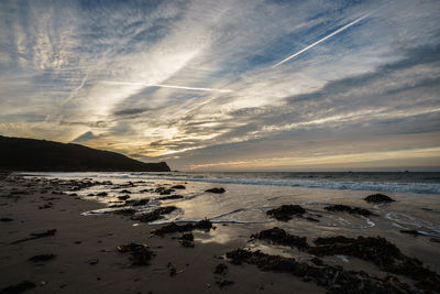 Scenic view of sea against cloudy sky