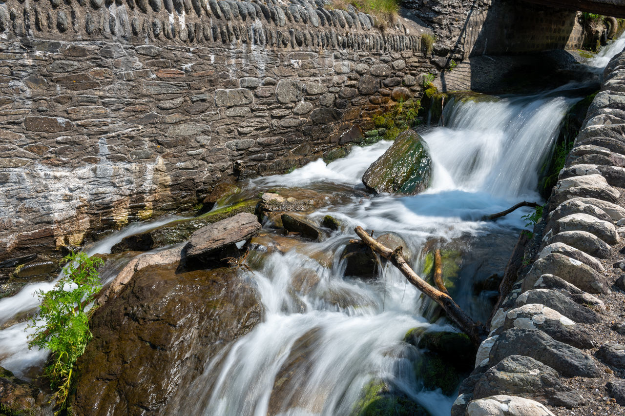 WATER FLOWING THROUGH ROCKS