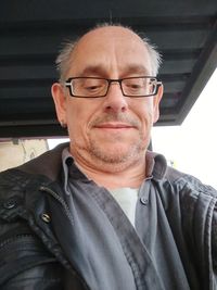 Portrait of man wearing eyeglasses