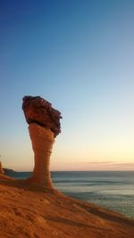 View of beach at sunset