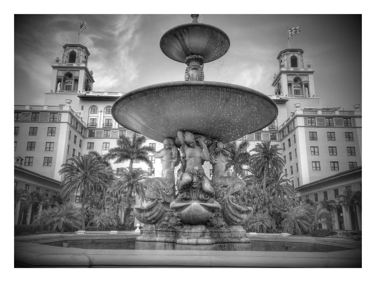 transfer print, building exterior, architecture, built structure, auto post production filter, tree, low angle view, city, sky, street light, statue, outdoors, sculpture, clear sky, incidental people, day, travel destinations, no people, art and craft, human representation