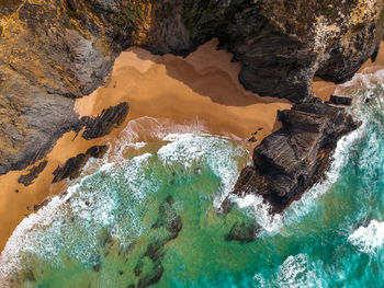 High angle view of rock formation in sea