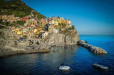 Panoramic view of sea and buildings against sky