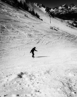 High angle view of man skiing on snow covered field