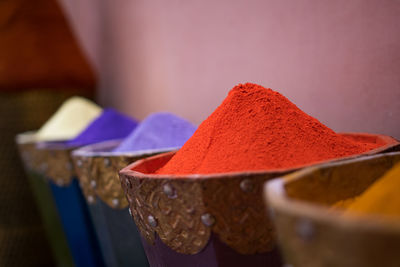 Colorful powder paint arranged in containers for sale
