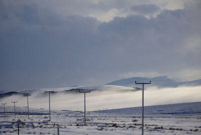 Scenic view of snow covered mountain against sky