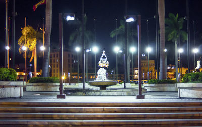 Illuminated statue against sky at night