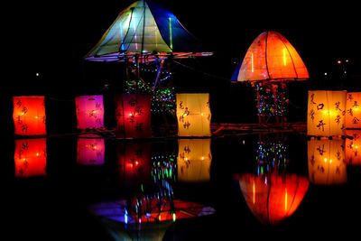 Illuminated lights in lake at night