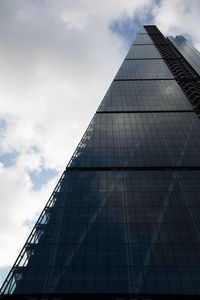 Low angle view of skyscraper against sky