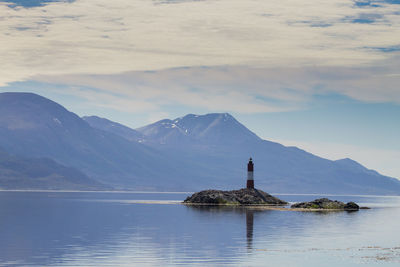 Scenic view of lake and mountains against sky