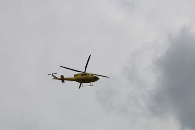 Low angle view of airplane against sky