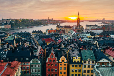 High angle view of city against sky during sunset