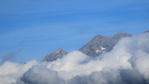 Low angle view of majestic mountains against sky