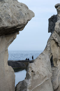 Sea against sky seen through rock formations at jumunjin port