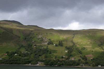 Scenic view of mountain against cloudy sky