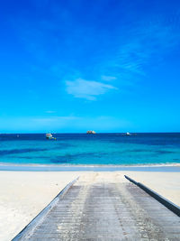 Scenic view of sea against blue sky